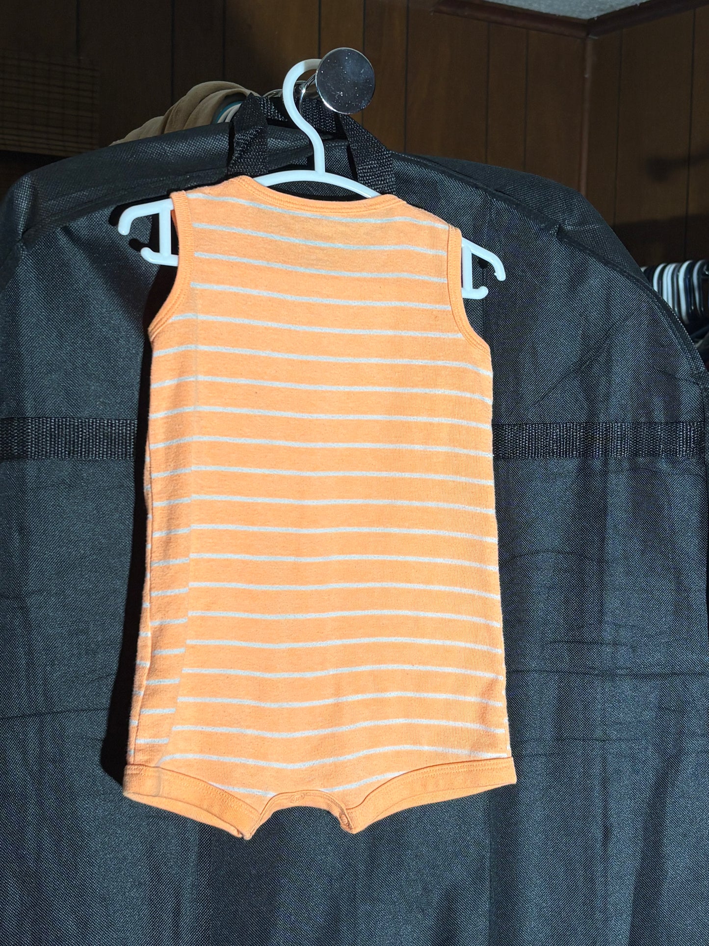 Size 6 month orange striped one piece
