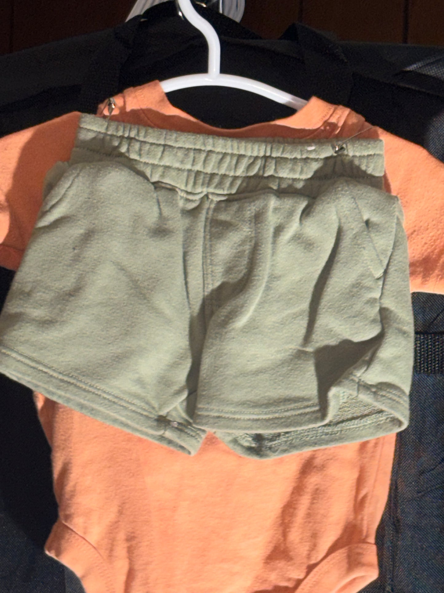 Size 3-6 months, Garanimals brand, orange onesie with green shorts