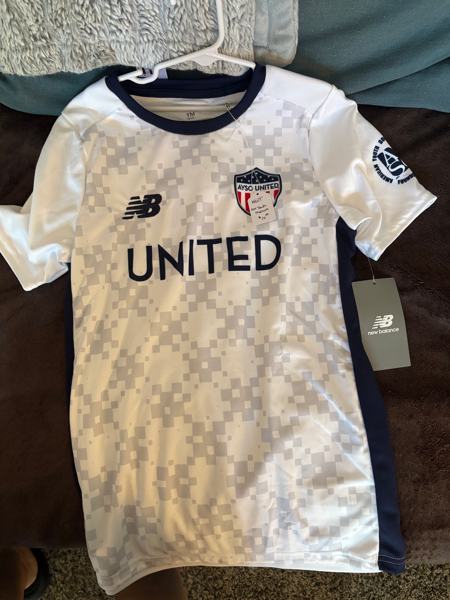Size Youth Medium New Balance white and Navy soccer jersey