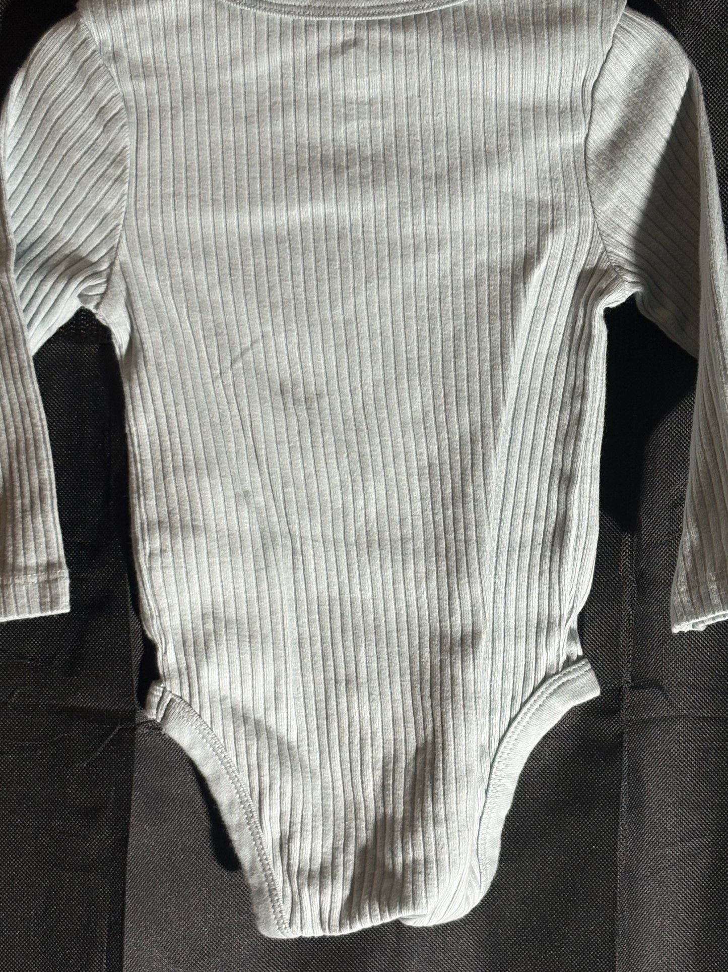 Size 6-9 month, cloud island brand, light blue long sleeve onesie