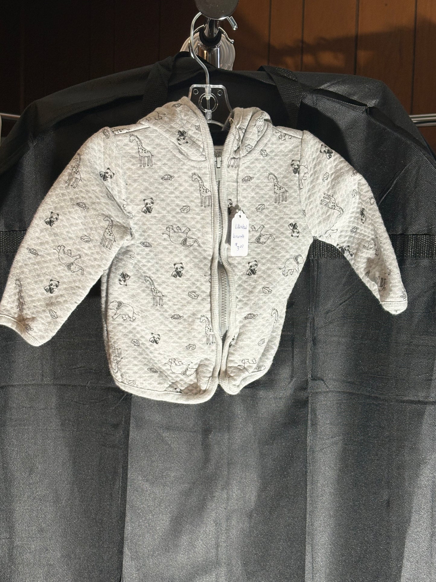 Size 6 month, gray quilted hooded zip up jacket with animal print