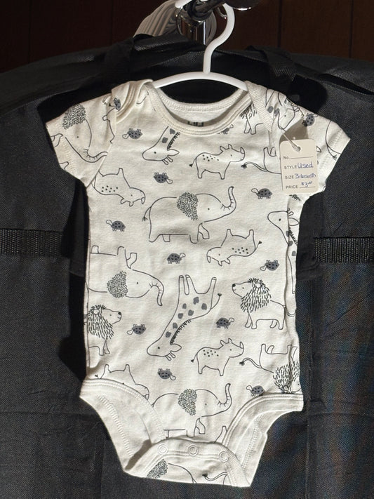 Size 3-6 month, Carters brand, white onesie with animal print and black shorts