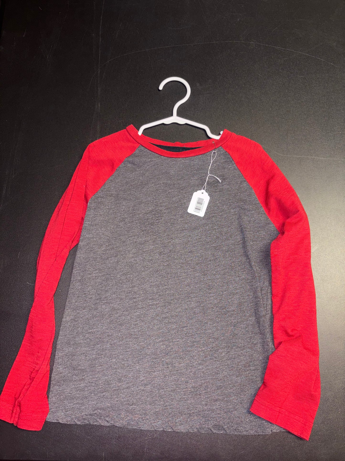 Size 6/7 Youth, long sleeved gray shirt with red sleeves