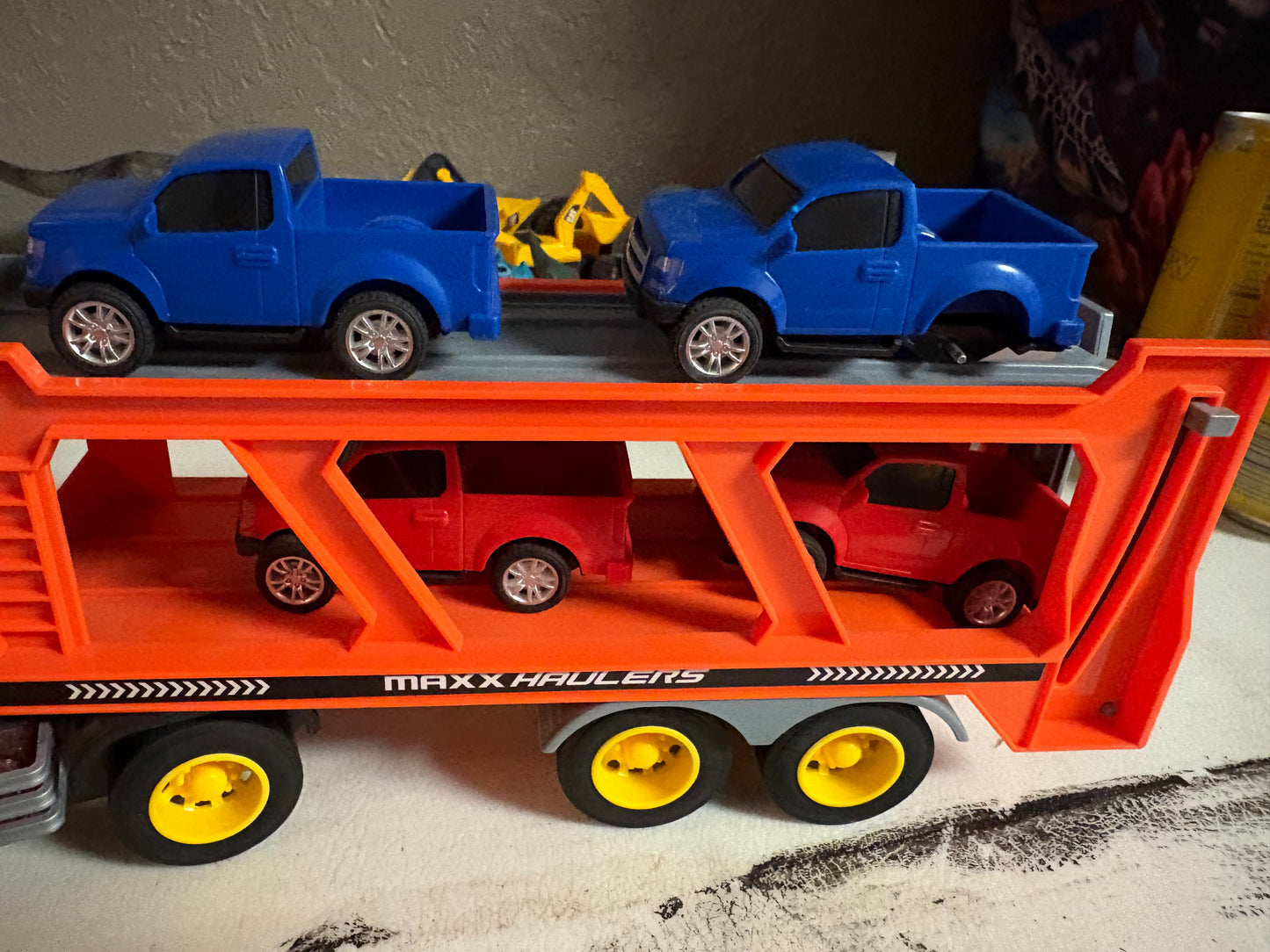 Truck with car trailer - 4 cars (one is missing a wheel)