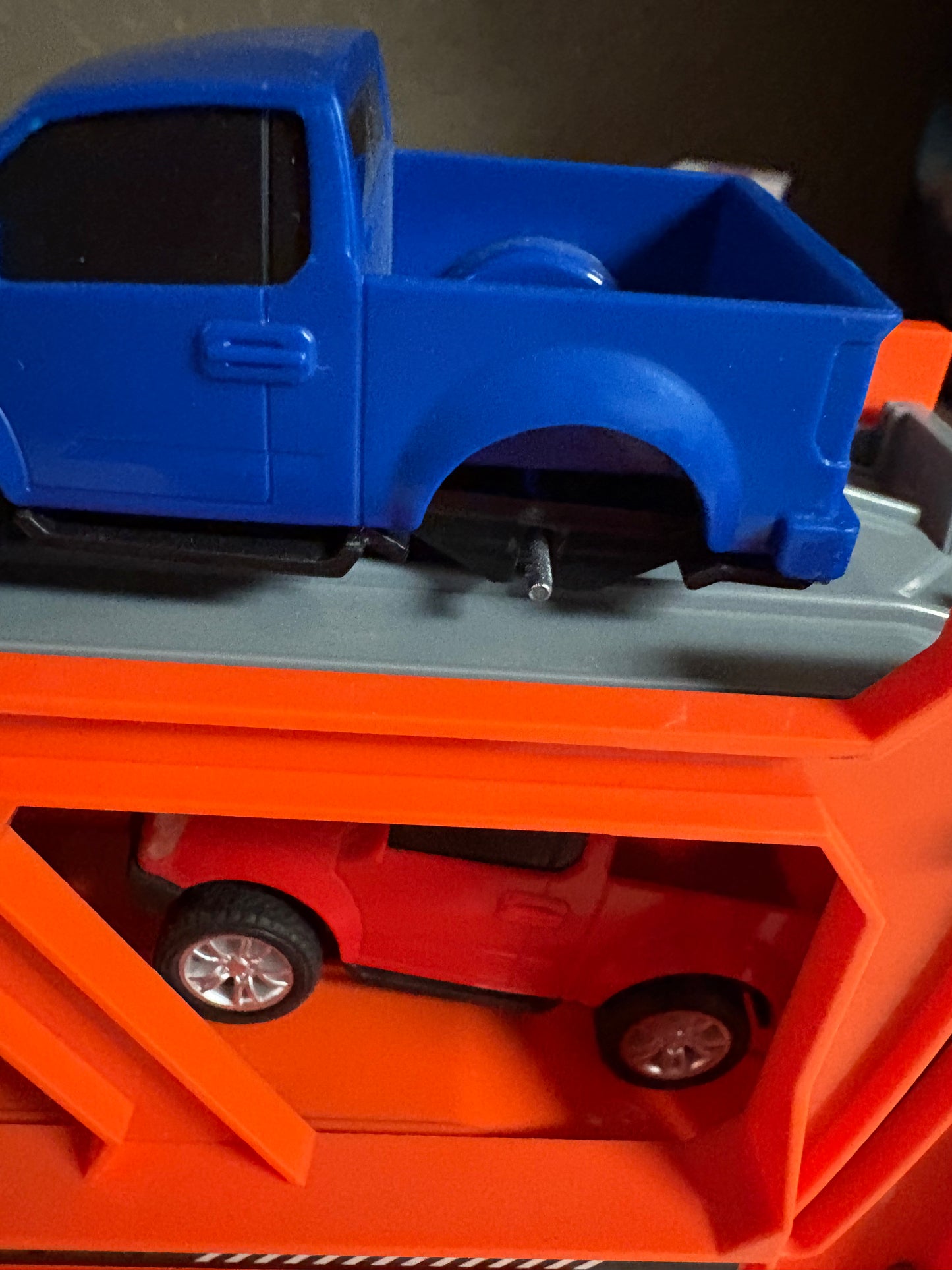 Truck with car trailer - 4 cars (one is missing a wheel)